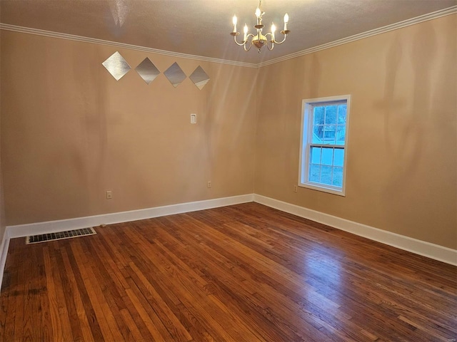 spare room featuring crown molding, hardwood / wood-style floors, a chandelier, and a textured ceiling