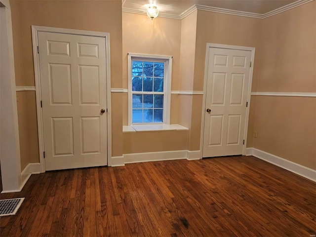 entryway featuring dark hardwood / wood-style flooring and crown molding