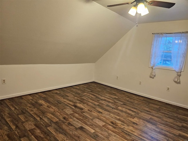 additional living space featuring vaulted ceiling, ceiling fan, and dark wood-type flooring