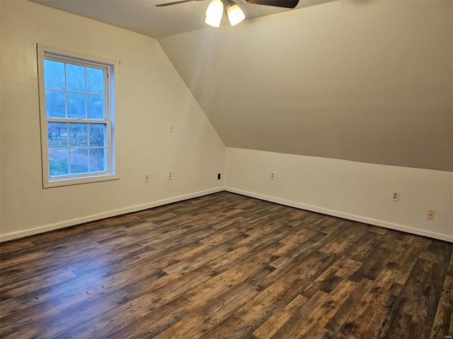 additional living space with ceiling fan, dark wood-type flooring, and lofted ceiling