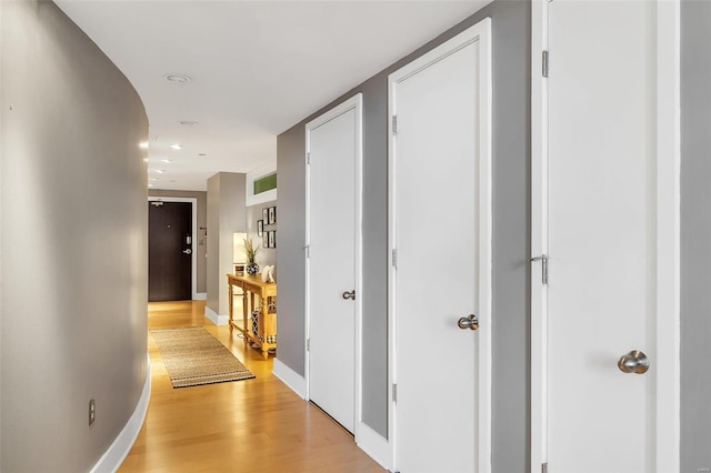 corridor featuring light hardwood / wood-style floors