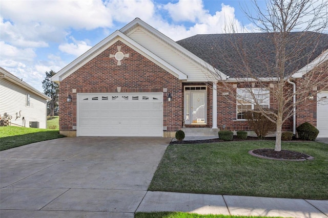 view of front of house with a front yard, central AC, and a garage