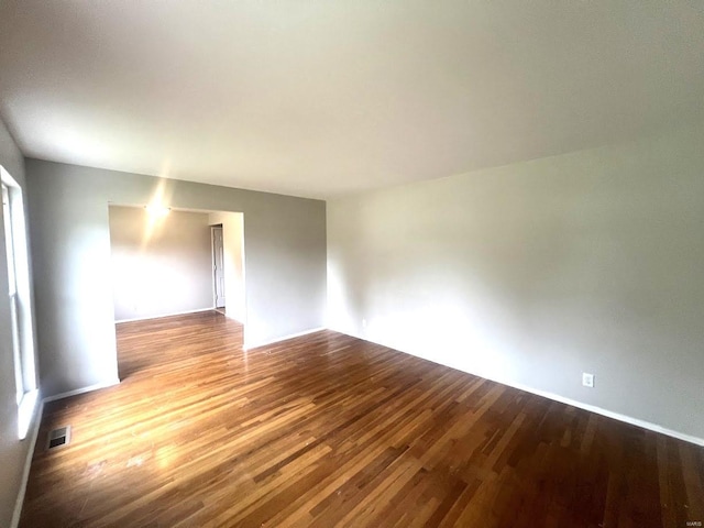 spare room with hardwood / wood-style floors