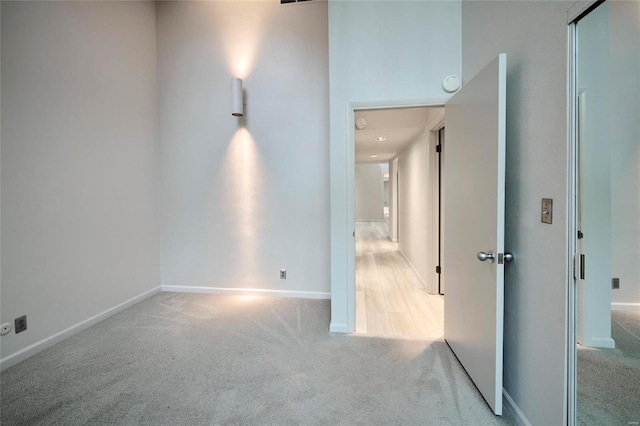 empty room featuring light colored carpet