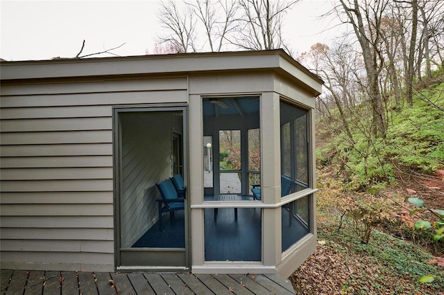 view of outbuilding featuring a sunroom