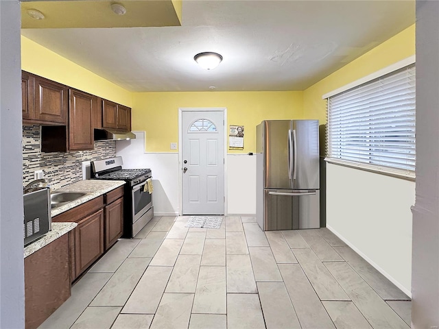 kitchen featuring decorative backsplash and stainless steel appliances