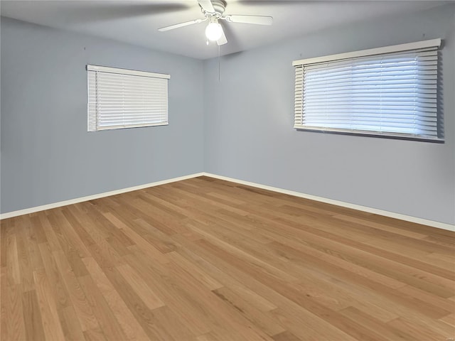 empty room with light hardwood / wood-style floors and ceiling fan