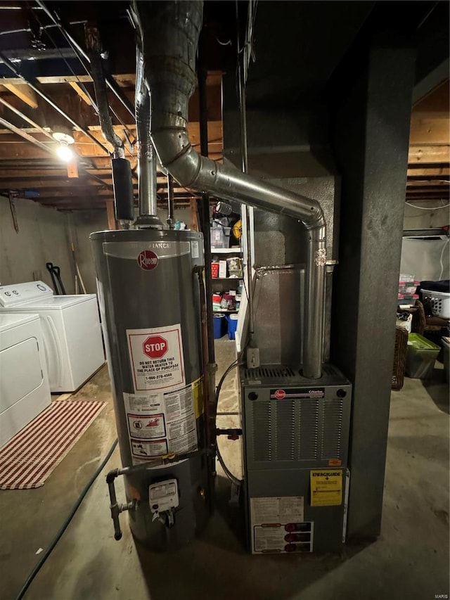 utility room featuring independent washer and dryer and gas water heater