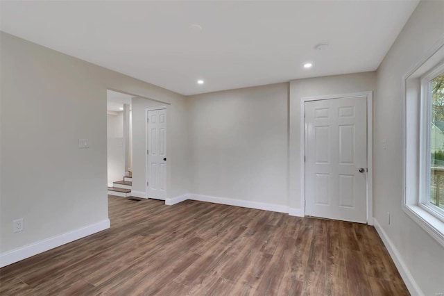 spare room featuring dark hardwood / wood-style floors