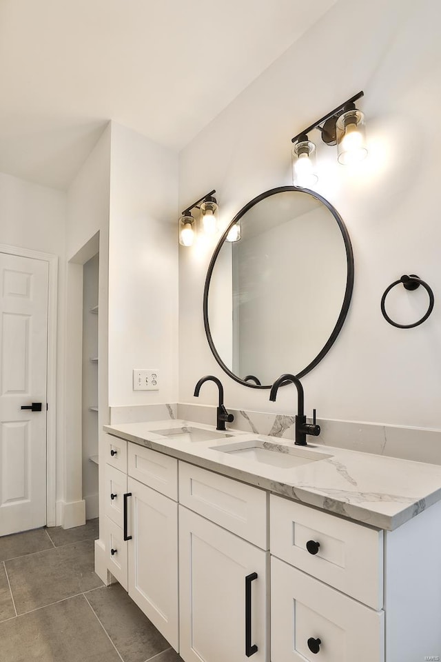 bathroom featuring tile patterned flooring and vanity