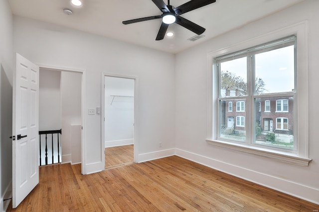 unfurnished room featuring ceiling fan and light hardwood / wood-style flooring