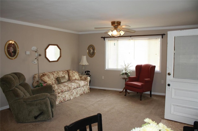 carpeted living room featuring ceiling fan and ornamental molding