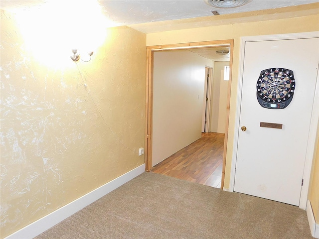 corridor with light wood-type flooring