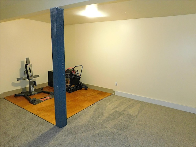 workout area with hardwood / wood-style floors