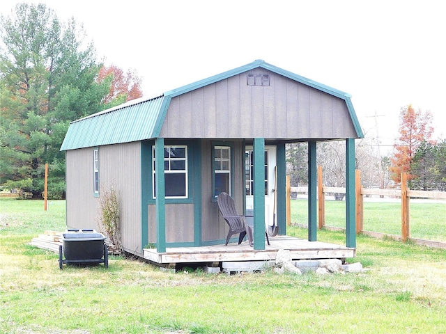 view of outdoor structure featuring a lawn