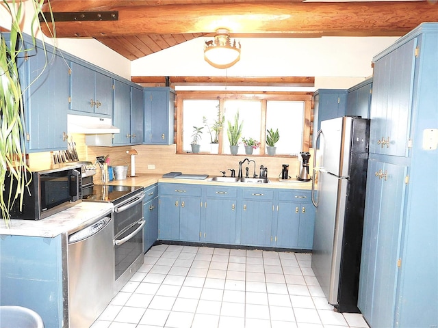 kitchen featuring lofted ceiling with beams, blue cabinets, sink, light tile patterned floors, and appliances with stainless steel finishes