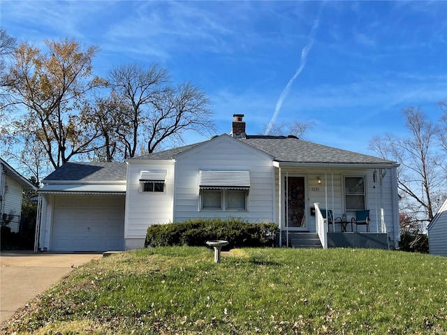 view of front of property with a garage, a porch, and a front lawn