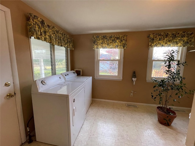 laundry room with separate washer and dryer