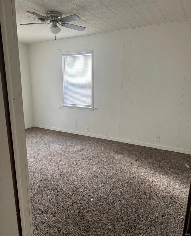 empty room with carpet and ceiling fan