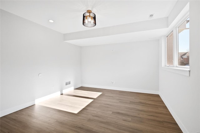 empty room featuring hardwood / wood-style flooring