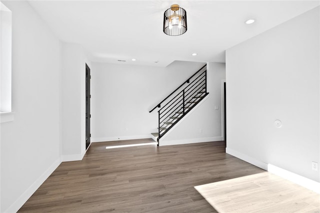 entryway with hardwood / wood-style flooring