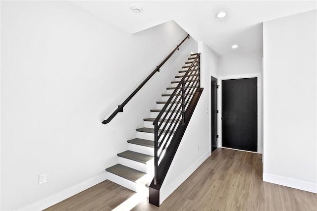 stairway with wood-type flooring