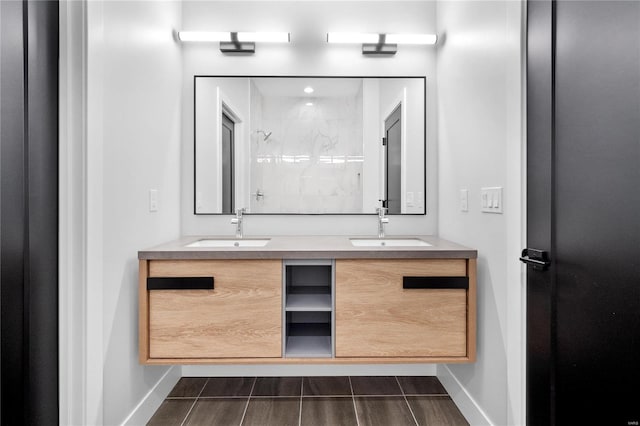 bathroom with vanity and tiled shower