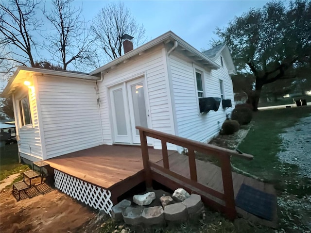 view of side of property with a deck