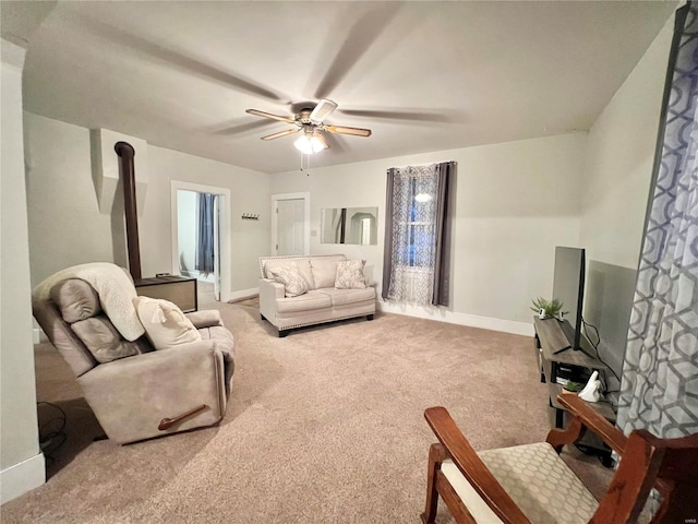 living room featuring carpet flooring and ceiling fan