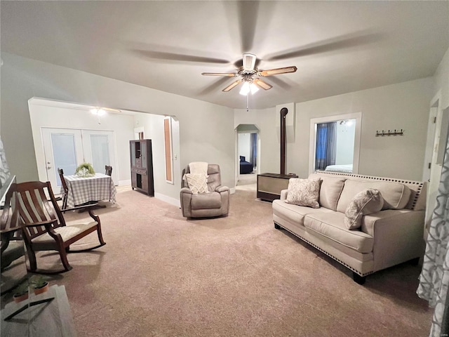 living room featuring carpet flooring and ceiling fan