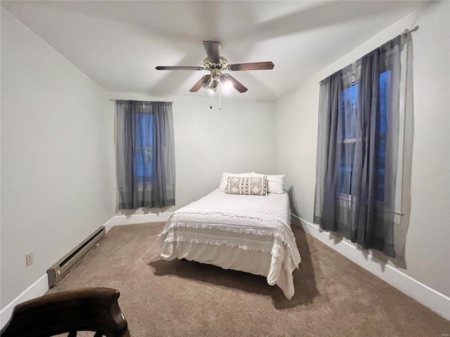 carpeted bedroom with ceiling fan and a baseboard radiator