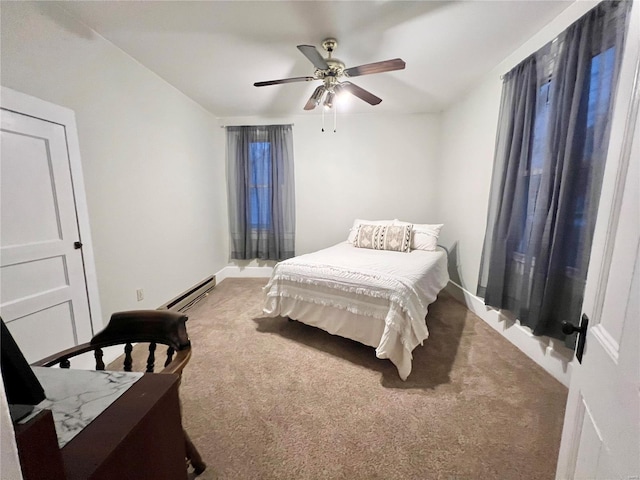 carpeted bedroom featuring baseboard heating and ceiling fan