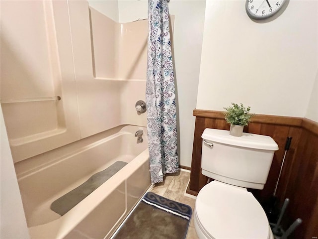 bathroom with toilet and shower / bathtub combination with curtain