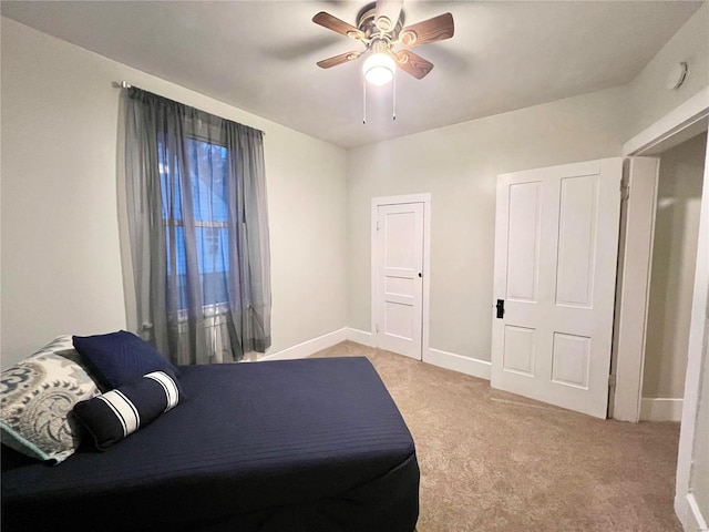 carpeted bedroom with ceiling fan