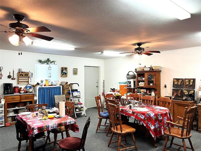 dining space featuring carpet flooring and a textured ceiling