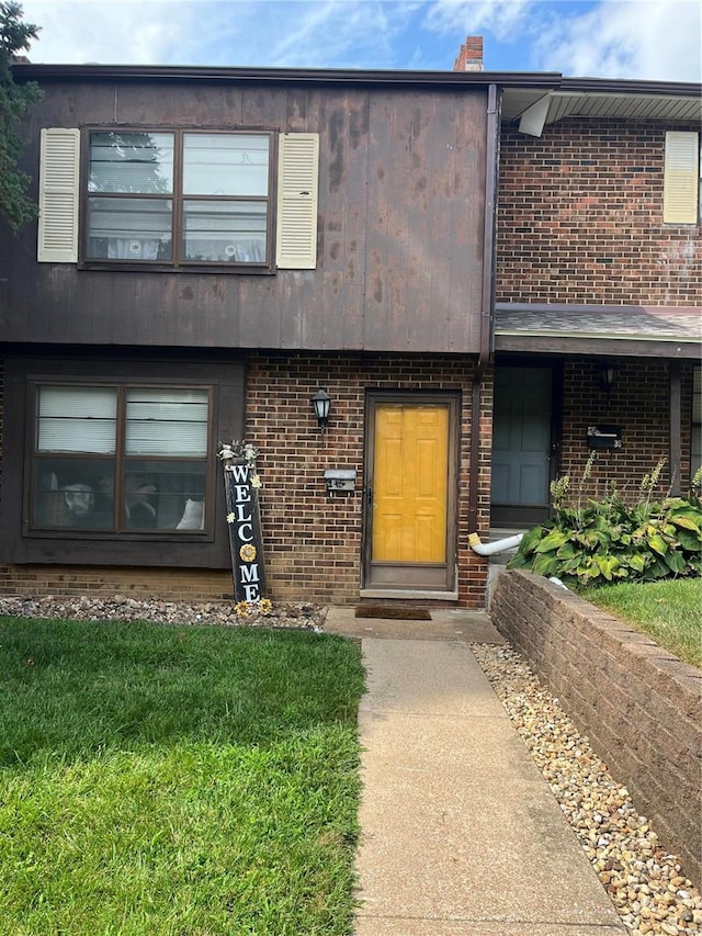 view of property with a front lawn