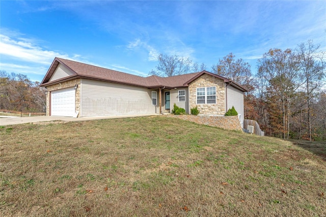 single story home featuring a front yard and a garage