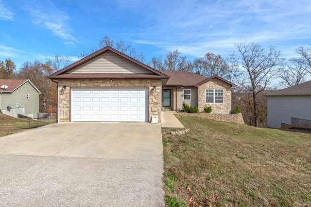 single story home featuring a front lawn and a garage