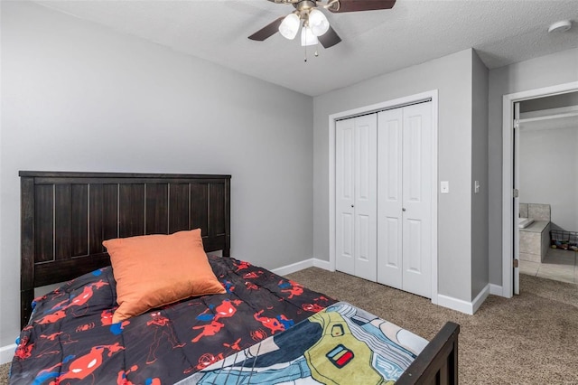 bedroom featuring carpet, a textured ceiling, a closet, and ceiling fan