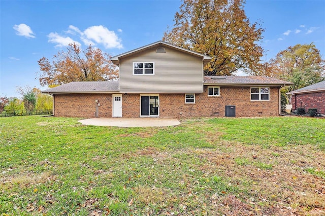 back of property featuring central air condition unit, a patio area, and a lawn