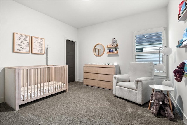 carpeted bedroom with a nursery area