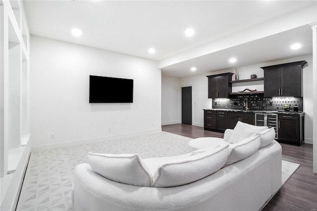 living room featuring dark hardwood / wood-style floors and sink