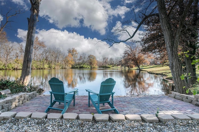 view of patio with a water view