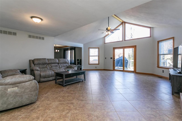 living room with ceiling fan, light tile patterned floors, and high vaulted ceiling