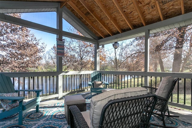 wooden terrace featuring a water view