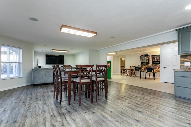 dining room with light hardwood / wood-style flooring