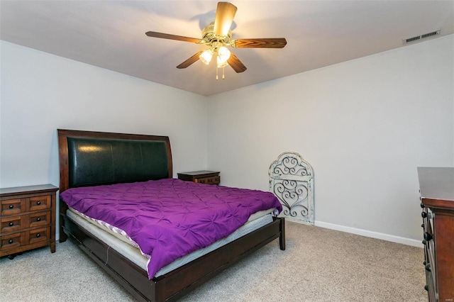 bedroom featuring ceiling fan and light colored carpet