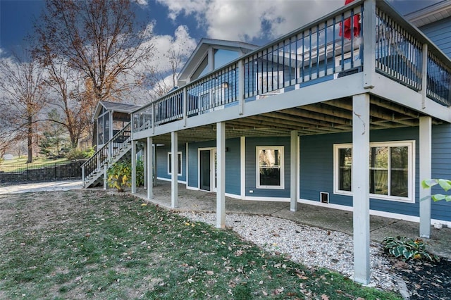 view of side of property featuring a deck