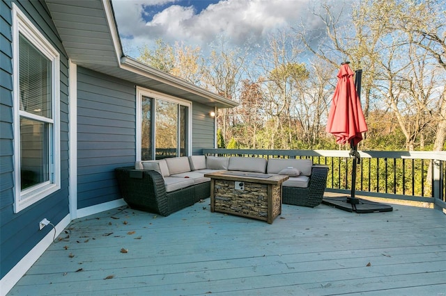 wooden terrace featuring an outdoor living space