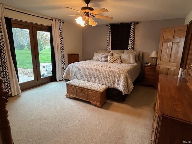 bedroom with ceiling fan, access to exterior, and light carpet